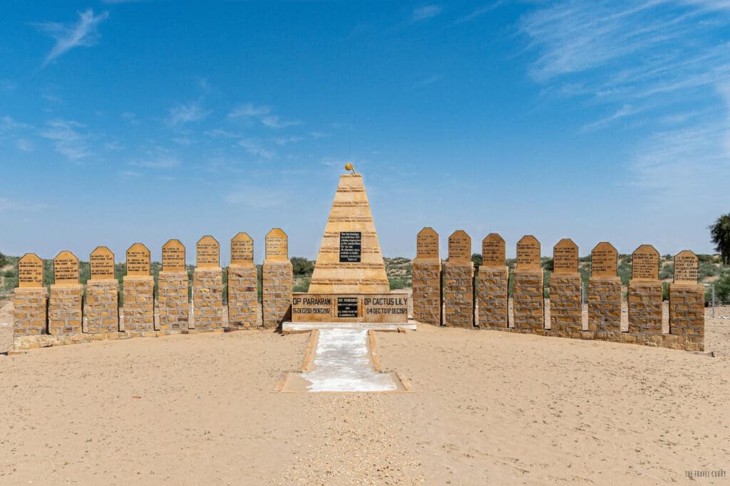 a stone monument with a group of stone pillars
